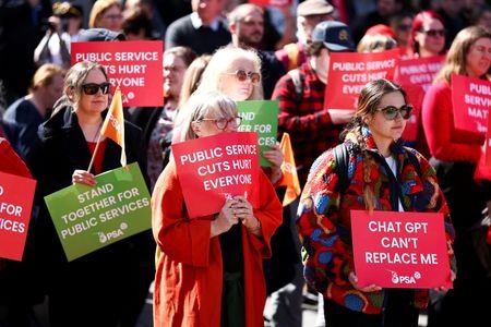 Protestors look on during a Public Service Association rally in