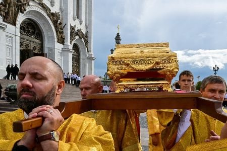 FILE PHOTO: Bearers carry a case with relics of a