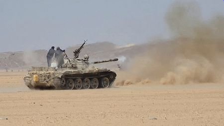 Saudi-backed Yemeni government forces clash with Yemen's Iran-aligned Houthis in