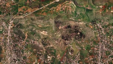 A satellite image shows damage at the Ali al-Taher ridge