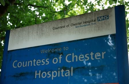 FILE PHOTO: Signage is seen outside an entrance to the