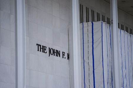 Tarp remains surrounding scaffolding after the removal of letters from