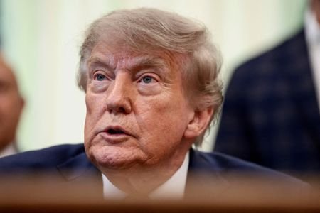 FILE PHOTO: U.S. President Donald Trump signs executive orders at