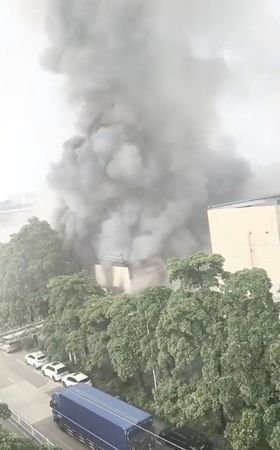 Smoke rises from a structure after a fire broke out