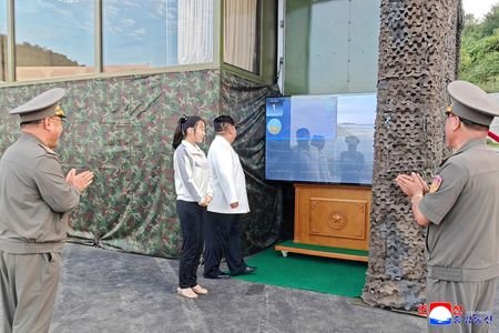 North Korean leader Kim Jong Un, accompanied by his daughter