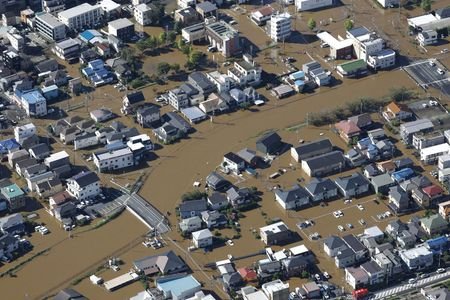 An aerial view shows a residential area flooded due to