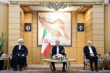 Iranian President Masoud Pezeshkian speaks before departing for New York,