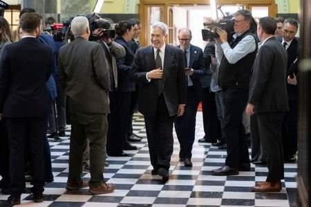New Zealand First leader Winston Peters reacts as he walks