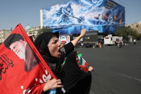 An Iranian woman shouts during a march in Tehran