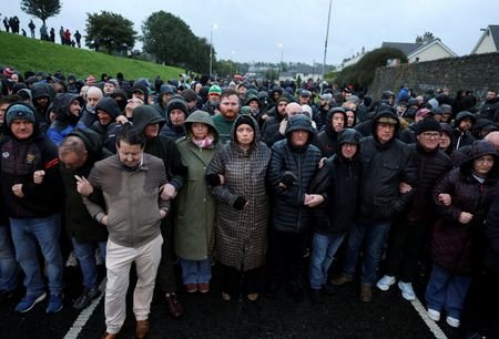 Members of the Orange Order march through Drumcree in Portadown
