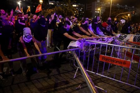 Protesters demand Spanish government limit evictions, pensioner to return home