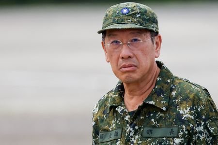 Taiwan's Defence Minister Wellington Koo reacts during the annual Han