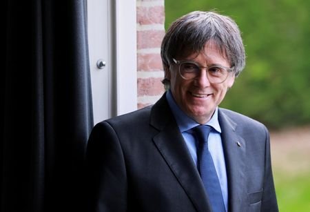 Catalan separatist Puigdemont set to return home after court lifts arrest warrant
