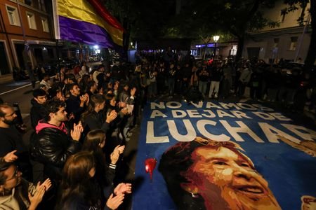 Thousands of Spaniards march to mark death of octogenarian at heart of housing protests