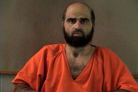 FILE PHOTO: Handout photo of Nidal Hasan, charged with killing