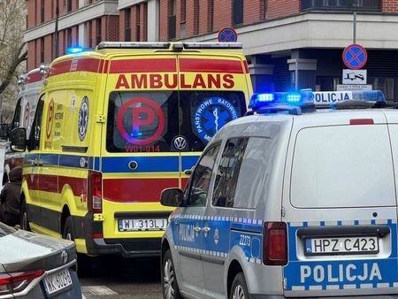 Ambulances stand outside a TEB Edukacja post-secondary school building following