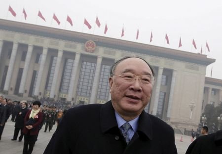 FILE PHOTO: Chongqing mayor Huang Qifan leaves the Great Hall