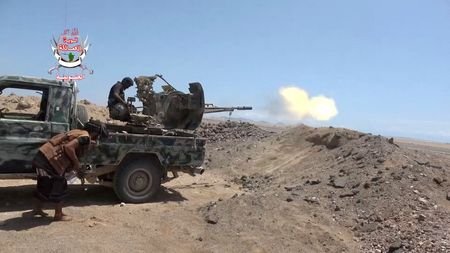 FILE PHOTO: A pro-Saudi-backed Yemeni government fighter fires a vehicle-mounted