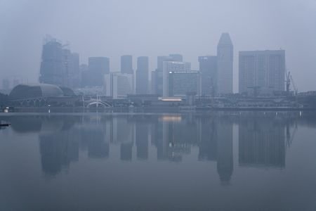 Buildings shrouded in haze from forest fires in neighbouring Indonesia,