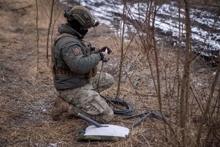 FILE PHOTO: A Ukrainian serviceman of 47th brigade prepares a