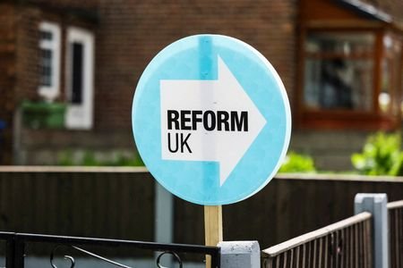 FILE PHOTO: A campaign placard for the Reform UK party