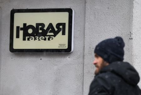 A man stands outside the office of Novaya Gazeta newspaper