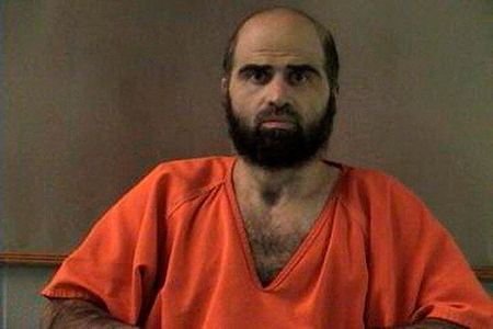 FILE PHOTO: Handout photo of Nidal Hasan, charged with killing