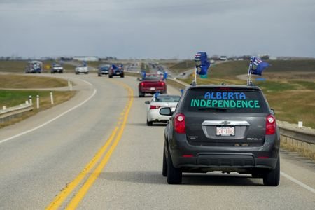 FILE PHOTO: Supporters of an Alberta separation referendum drive in