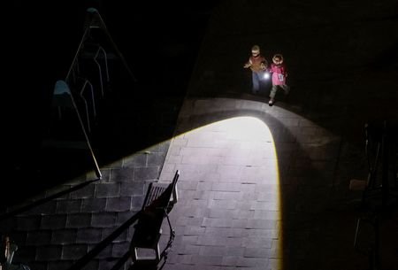 Children use a flashlight when they go to play at