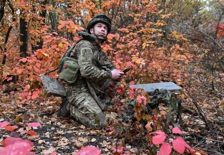 An artilleryman of the Special Rifle Police Battalion sets up