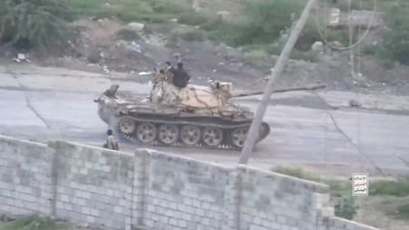 Clashes between Houthi fighters and Saudi-backed Yemeni government forces in