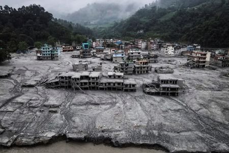 FILE PHOTO: A drone view shows houses covered in mud