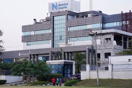 People stand outside Nizamiye Hospital in Abuja, Nigeria