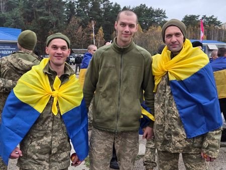 Ukrainian POWs after a swap at an unknown location in