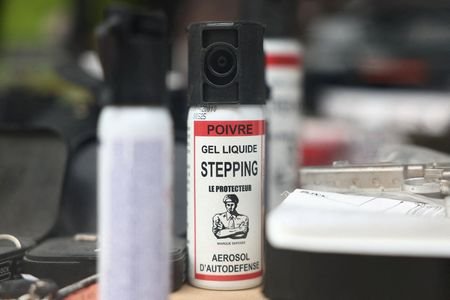 FILE PHOTO: Pepper spray canisters on display in the window
