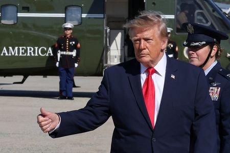 US President Donald Trump boards Air Force One at JBA