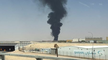 FILE PHOTO: Large plume of black smoke rises from the