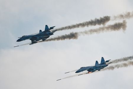 Russian Sukhoi Su-35 jet fighters fire missiles during the Aviadarts