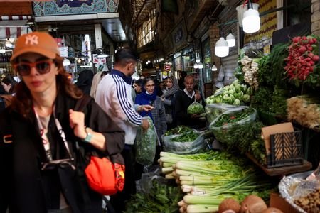 People walk at Tajrish Bazaar in Tehran