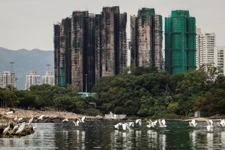 The Wider Image - Hong Kong fire: Echoes of loss