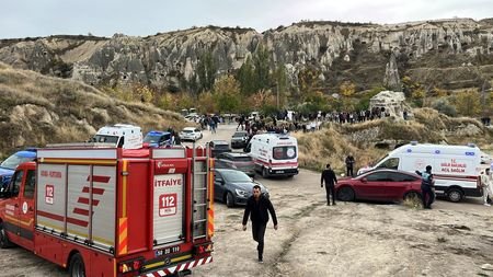 A fire truck and ambulances are parked near the scene